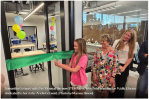 Samantha Gotwald cuts the ribbon at the new STEM lab at Westfield Washington Public Library, dedicated to her sister Annie Gotwald. 